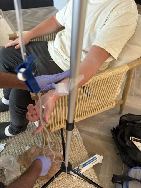 A client relaxing during an at-home IV